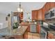 Updated kitchen featuring granite countertops, stainless steel appliances, and plenty of counter space at 2006 Carrollton Hwy, Temple, GA 30179