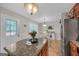 An eat in kitchen featuring a view of the backyard through the door, and stainless steel appliances at 2006 Carrollton Hwy, Temple, GA 30179