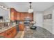 The kitchen boasts granite countertops, stainless steel appliances, and warm wood cabinets at 2006 Carrollton Hwy, Temple, GA 30179