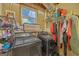 This utility room has a side-by-side washer and dryer and plenty of storage space for laundry supplies at 2006 Carrollton Hwy, Temple, GA 30179