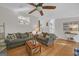 Comfortable living room featuring hardwood floors, cozy seating, and stairway to the basement at 2006 Carrollton Hwy, Temple, GA 30179