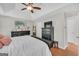 Bright main bedroom with black furniture and wood flooring at 2006 Carrollton Hwy, Temple, GA 30179