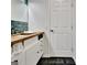 Bathroom with a custom wood vanity top and plenty of storage space for linens at 152 Dana Dr, Fayetteville, GA 30215