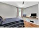 Cozy bedroom features a built-in desk, wood floors, with a gray wall paint to add a soothing ambiance at 152 Dana Dr, Fayetteville, GA 30215