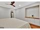 Bright bedroom featuring a ceiling fan, a built-in shelving unit and a walk-in closet at 152 Dana Dr, Fayetteville, GA 30215
