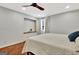 Bedroom with wood floors and white quilt on the bed at 152 Dana Dr, Fayetteville, GA 30215