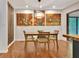 Modern dining area with unique light fixture and art work at 152 Dana Dr, Fayetteville, GA 30215