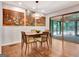 Bright dining area with wood floors and access to a screened-in porch at 152 Dana Dr, Fayetteville, GA 30215