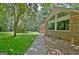Beautifully landscaped yard with a concrete walkway leading to this charming brick home at 152 Dana Dr, Fayetteville, GA 30215