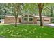 Beautiful brick home with large picture windows and a well-manicured lawn at 152 Dana Dr, Fayetteville, GA 30215