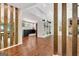 Hallway view showing wood floors, open floor plan, and natural light at 152 Dana Dr, Fayetteville, GA 30215