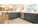 Modern kitchen featuring blue cabinets, butcher block counters and stainless steel appliances next to dining table at 152 Dana Dr, Fayetteville, GA 30215