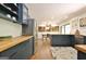 Modern kitchen featuring blue cabinets, butcher block counters and stainless steel appliances at 152 Dana Dr, Fayetteville, GA 30215