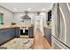 Modern kitchen with stainless steel appliances, butcher block countertops, and dark gray cabinetry at 152 Dana Dr, Fayetteville, GA 30215