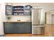 Modern kitchen featuring blue cabinets, butcher block counters, stainless steel appliances and new refrigerator at 152 Dana Dr, Fayetteville, GA 30215