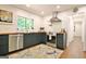 Modern kitchen featuring blue cabinets, butcher block counters, stainless steel appliances and recessed lighting at 152 Dana Dr, Fayetteville, GA 30215