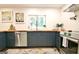 Modern kitchen featuring blue cabinets, butcher block counters, stainless steel appliances and recessed lighting at 152 Dana Dr, Fayetteville, GA 30215