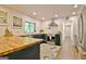 Modern kitchen featuring blue cabinets, butcher block counters, stainless steel appliances and recessed lighting at 152 Dana Dr, Fayetteville, GA 30215