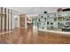 Open concept living room with wooden floors, shelving, and dining area at 152 Dana Dr, Fayetteville, GA 30215