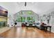 Living room with hardwood floors, large windows, fireplace, and stylish furniture at 152 Dana Dr, Fayetteville, GA 30215