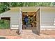 Interior of shed with shelving and ample storage, with brick base at 152 Dana Dr, Fayetteville, GA 30215