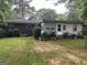 The home has a spacious backyard and patio at 4884 Maurice Nw Dr, Lilburn, GA 30047