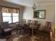 Traditional dining room featuring a classic chandelier, large wooden table, and vintage accents at 4884 Maurice Nw Dr, Lilburn, GA 30047