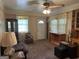 Inviting living room with natural light, comfortable seating, and vintage-style furnishings at 4884 Maurice Nw Dr, Lilburn, GA 30047
