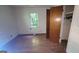 Bedroom with hardwood floors, closet, and natural light at 1417 Lake Cir, Mableton, GA 30126