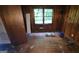 Wood paneled bedroom with window and hardwood flooring at 1417 Lake Cir, Mableton, GA 30126