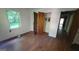Bedroom featuring hardwood floors, a window and an open closet at 1417 Lake Cir, Mableton, GA 30126