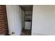 Laundry room featuring a washer, shelving and access to the backyard at 1417 Lake Cir, Mableton, GA 30126