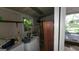 Small laundry room with washer, dryer, and shelving at 1417 Lake Cir, Mableton, GA 30126