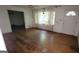 Empty living room featuring hardwood floors, white walls and natural light at 1417 Lake Cir, Mableton, GA 30126