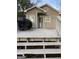 A wooden back deck and an exterior entrance to the house featuring a grill at 2134 Main Nw St, Atlanta, GA 30318