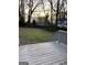 Looking out from the back deck onto a grass backyard with a wooden perimeter fence at 2134 Main Nw St, Atlanta, GA 30318