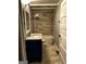 Bathroom featuring a vanity with granite countertops, tiled shower with bathtub, and wood-look tile flooring at 2134 Main Nw St, Atlanta, GA 30318