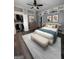 Serene bedroom featuring hardwood floors, a ceiling fan, a walk-in closet, and thoughtfully placed decorations at 2134 Main Nw St, Atlanta, GA 30318