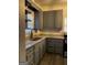 Updated kitchen with granite countertops, gray cabinetry, new faucet, and stainless steel appliances at 2134 Main Nw St, Atlanta, GA 30318