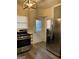 Modern kitchen with stainless steel appliances, wood-look floors, and ample natural light at 2134 Main Nw St, Atlanta, GA 30318