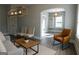 Bright living room features stylish light fixture, neutral paint, and archway entrance at 2134 Main Nw St, Atlanta, GA 30318