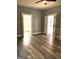 Open concept living space with hardwood floors and views into two other rooms, plus a ceiling fan at 2134 Main Nw St, Atlanta, GA 30318