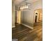 Open living area with updated lighting, hardwood floors, built-in shelving, and neutral gray paint at 2134 Main Nw St, Atlanta, GA 30318