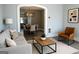 Inviting living room with stylish light fixture, modern decor, and neutral color palette at 2134 Main Nw St, Atlanta, GA 30318