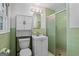 Updated bathroom featuring green tile, a shower, and a vanity at 7121 Forest Se Dr, Covington, GA 30014