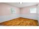 Bedroom with hardwood floors, natural light, and fresh paint at 7121 Forest Se Dr, Covington, GA 30014