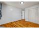 Bedroom with hardwood floors, a closet and white walls at 7121 Forest Se Dr, Covington, GA 30014