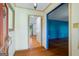 Welcoming entryway featuring hardwood floors, patterned wallpaper and colorful trim and doorframes at 7121 Forest Se Dr, Covington, GA 30014