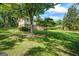Charming two-story home with brick facade, red shutters, and well-maintained landscaping in a lush, green setting at 7121 Forest Se Dr, Covington, GA 30014
