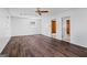 Bright living room featuring wood-look floors, neutral paint, and ample natural light at 7121 Forest Se Dr, Covington, GA 30014